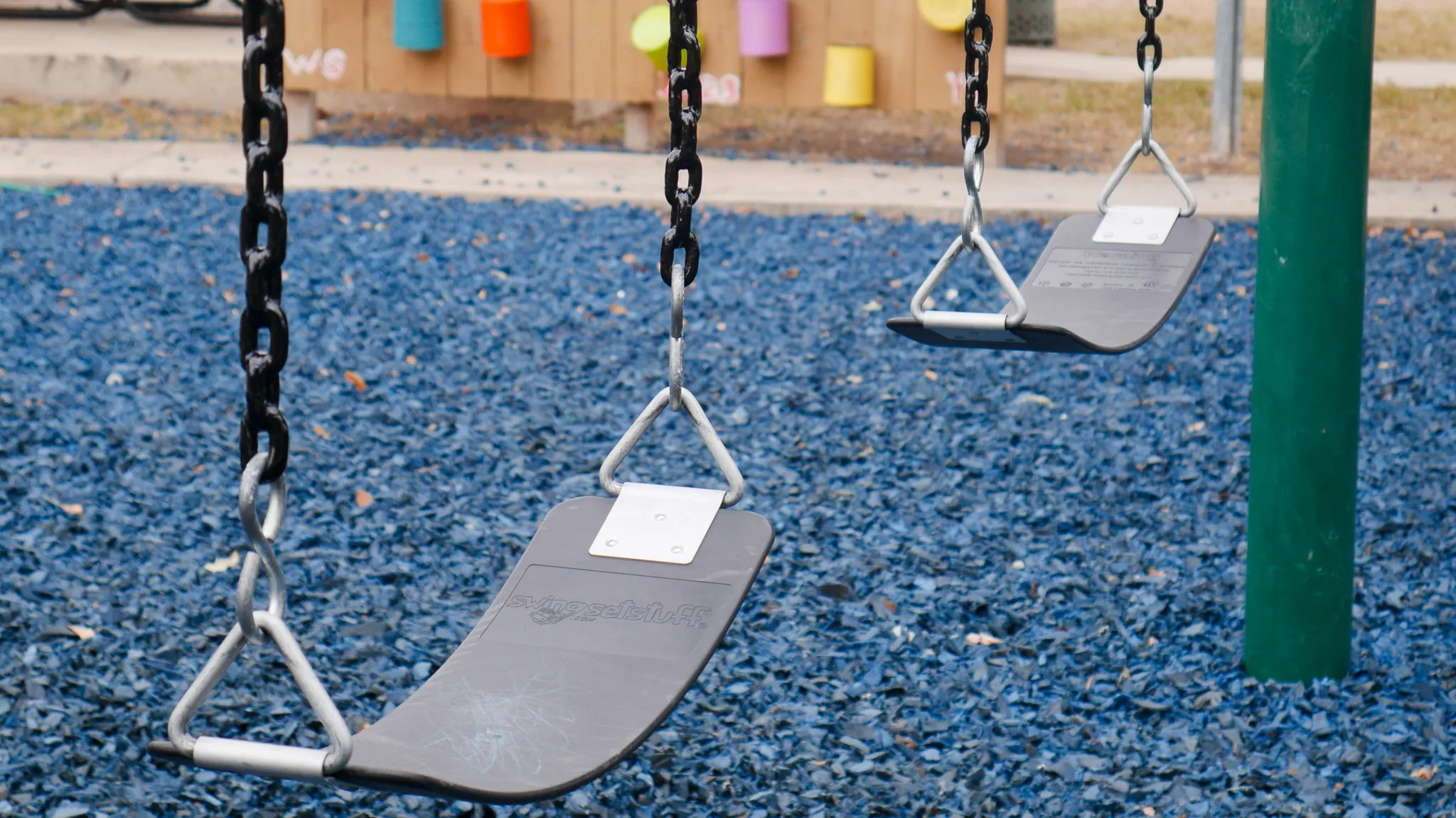 Repaired playground swing set at Bridgewood community park