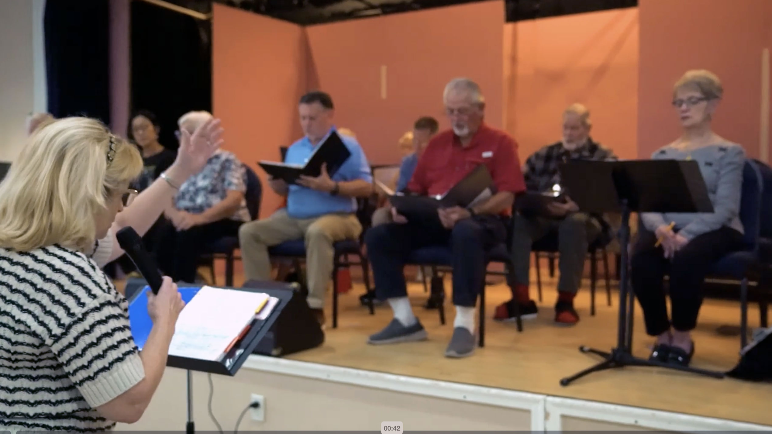 Community choir rehearsing on stage at CountryPlace