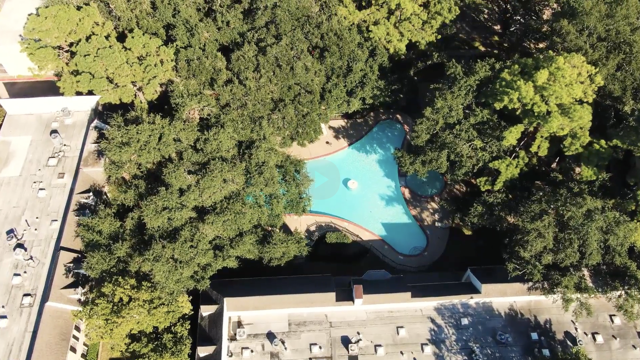 Aerial view of the tree-shaded Georgetown townhome community on Houston’s West Side