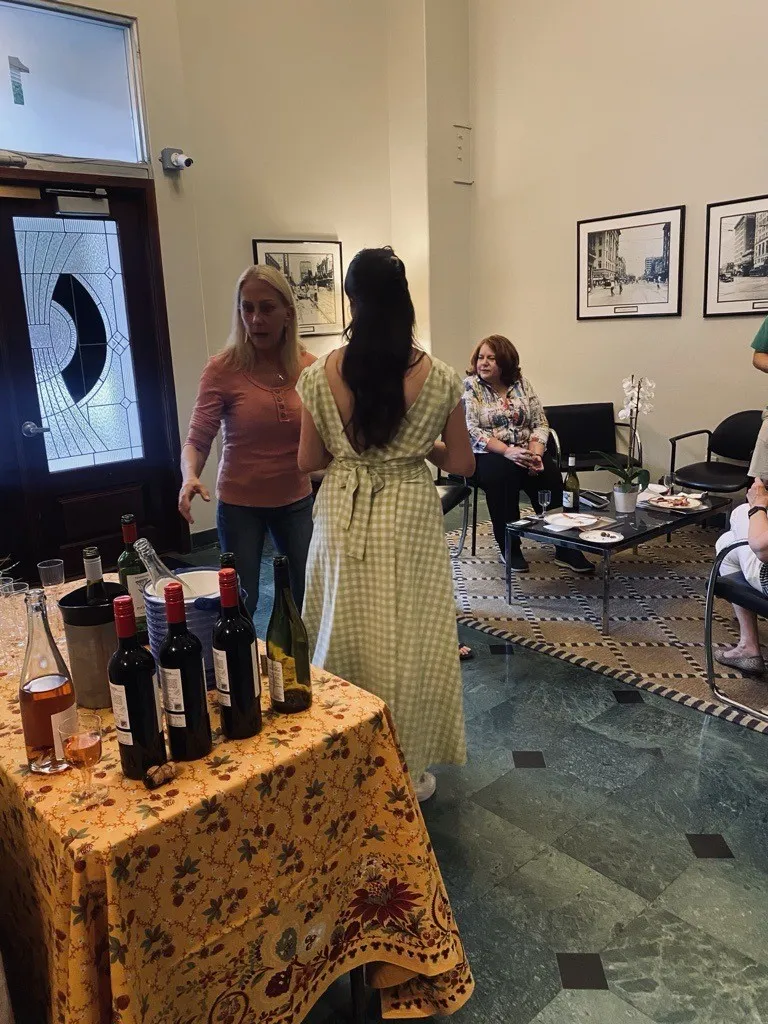 Residents gathered for a community event in the green-marble lobby of The Keystone Lofts in downtown Houston