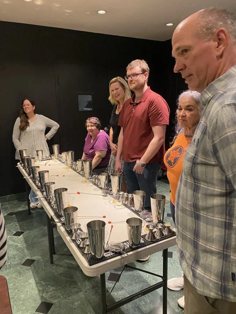 Residents socializing at a wine event at The Keystone Lofts