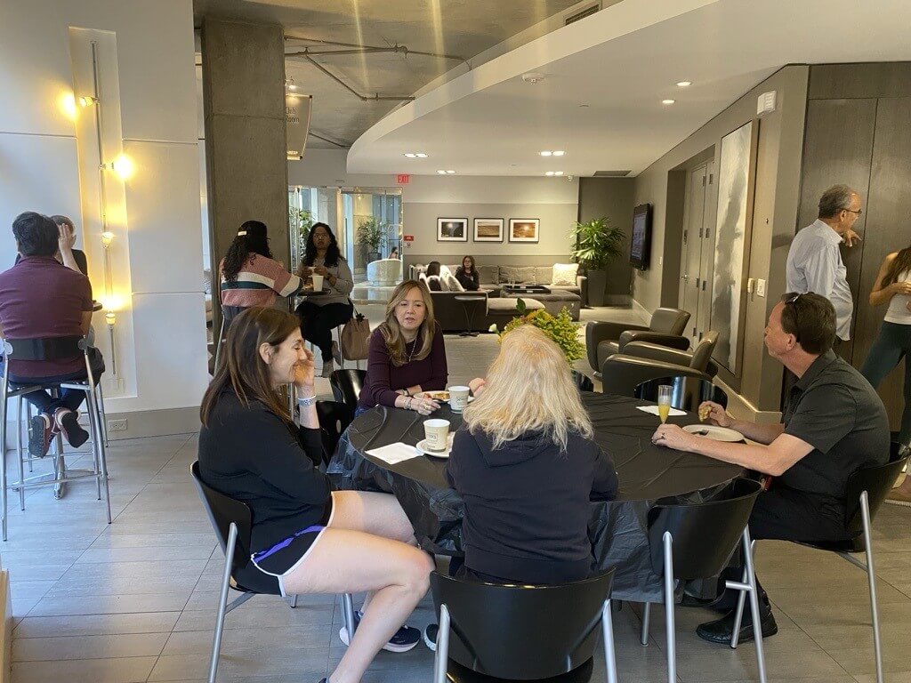 Residents at a club-room kitchen event at The Lofts on Post Oak