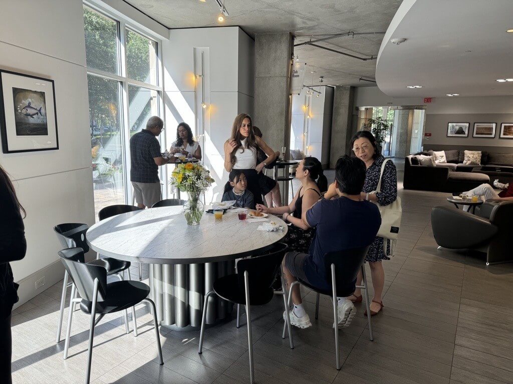 Residents seated in the club room at The Lofts on Post Oak