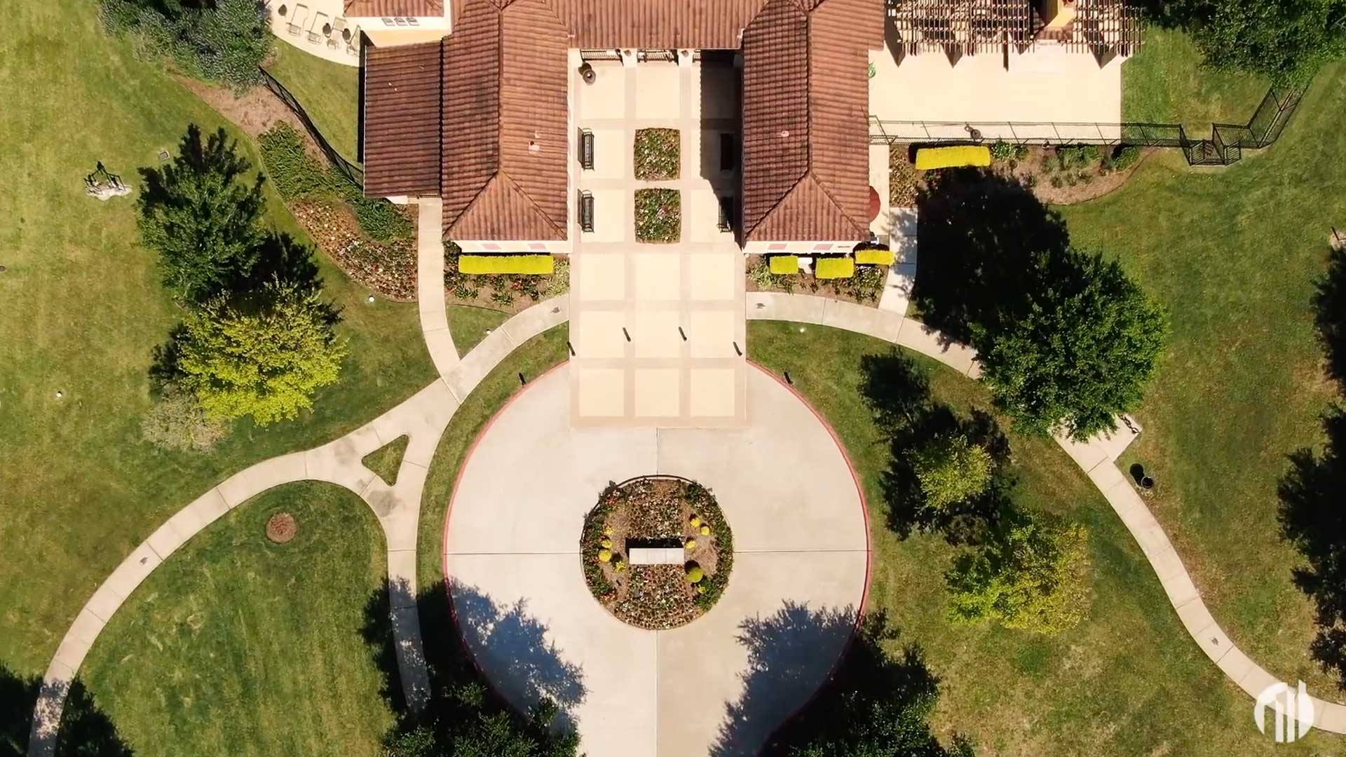 Overhead aerial of the Cypress Point clubhouse and gardens at Tuscan Lakes