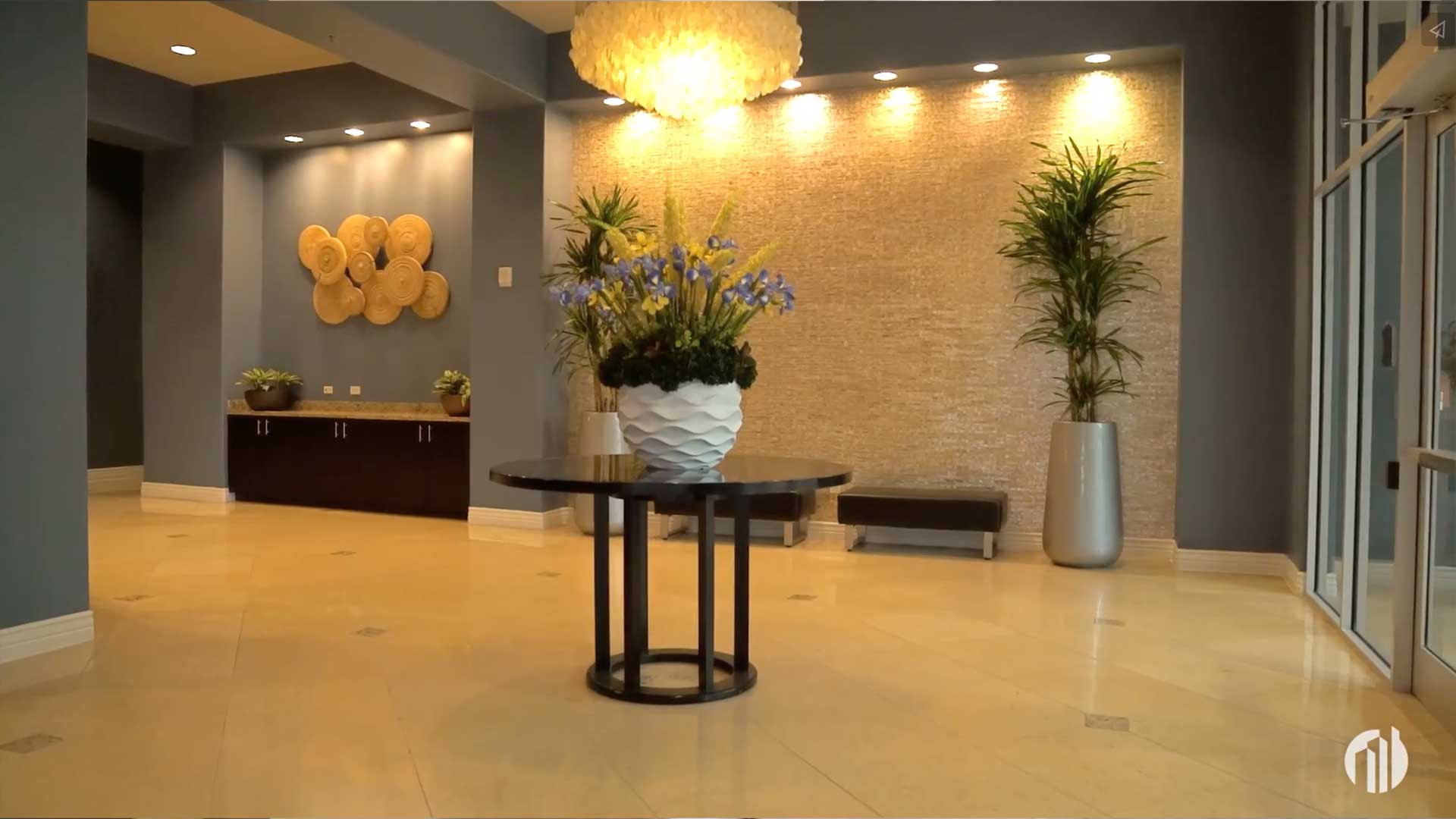 Lobby seating area with curated furnishings at Vidorra Condominiums