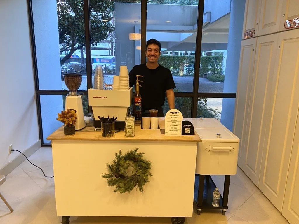 Barista at a coffee cart during a resident event at The Woodway