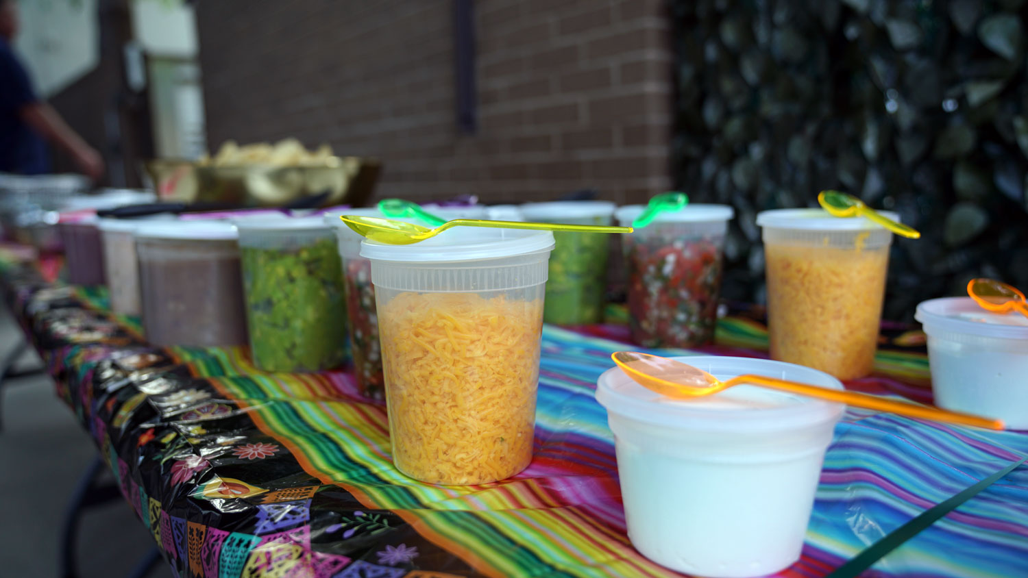 Residents at an outdoor fiesta gathering in the Woodway courtyard