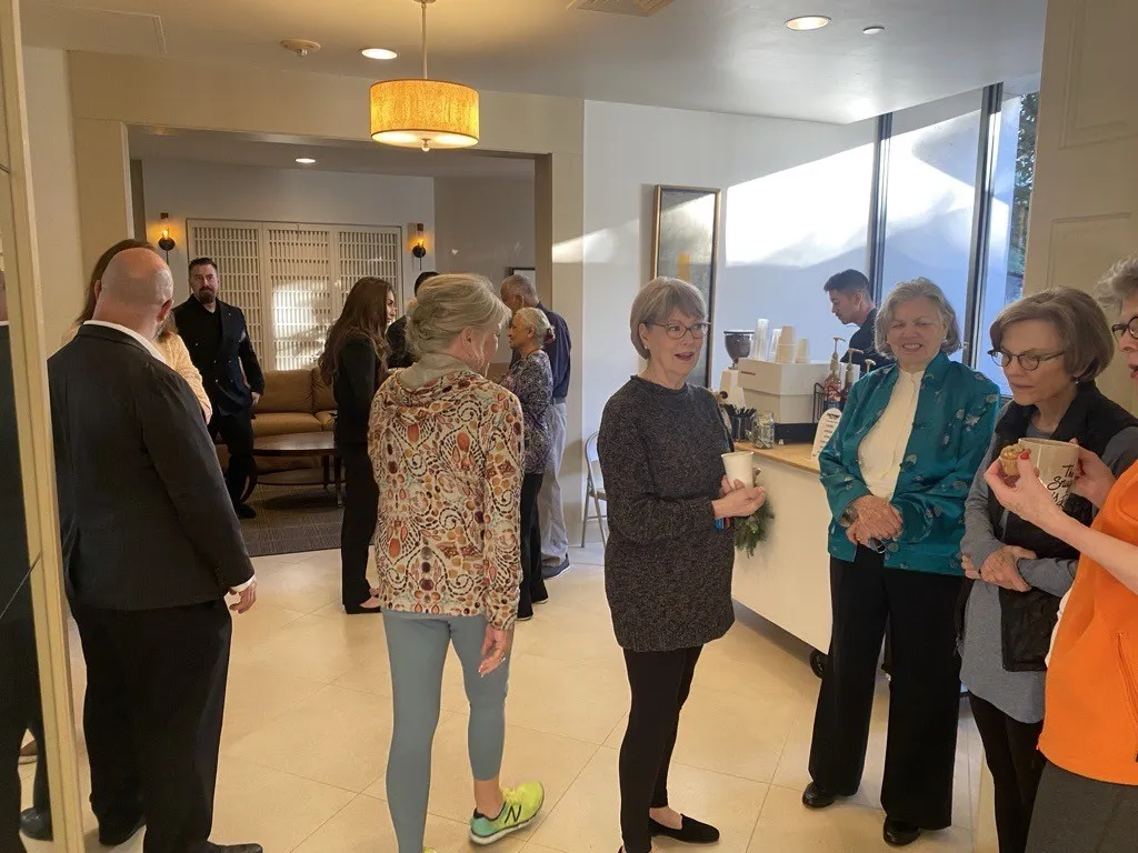 Residents mingling in the lobby of The Woodway Condominium