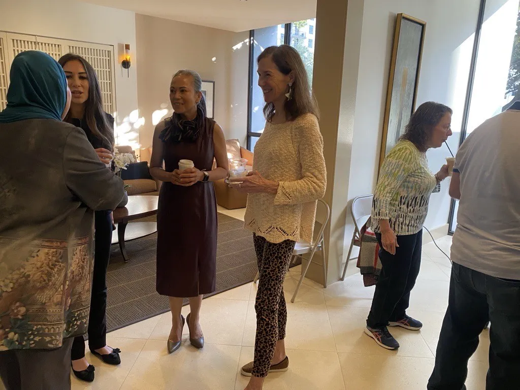 Sunlit lobby gathering at The Woodway Condominium